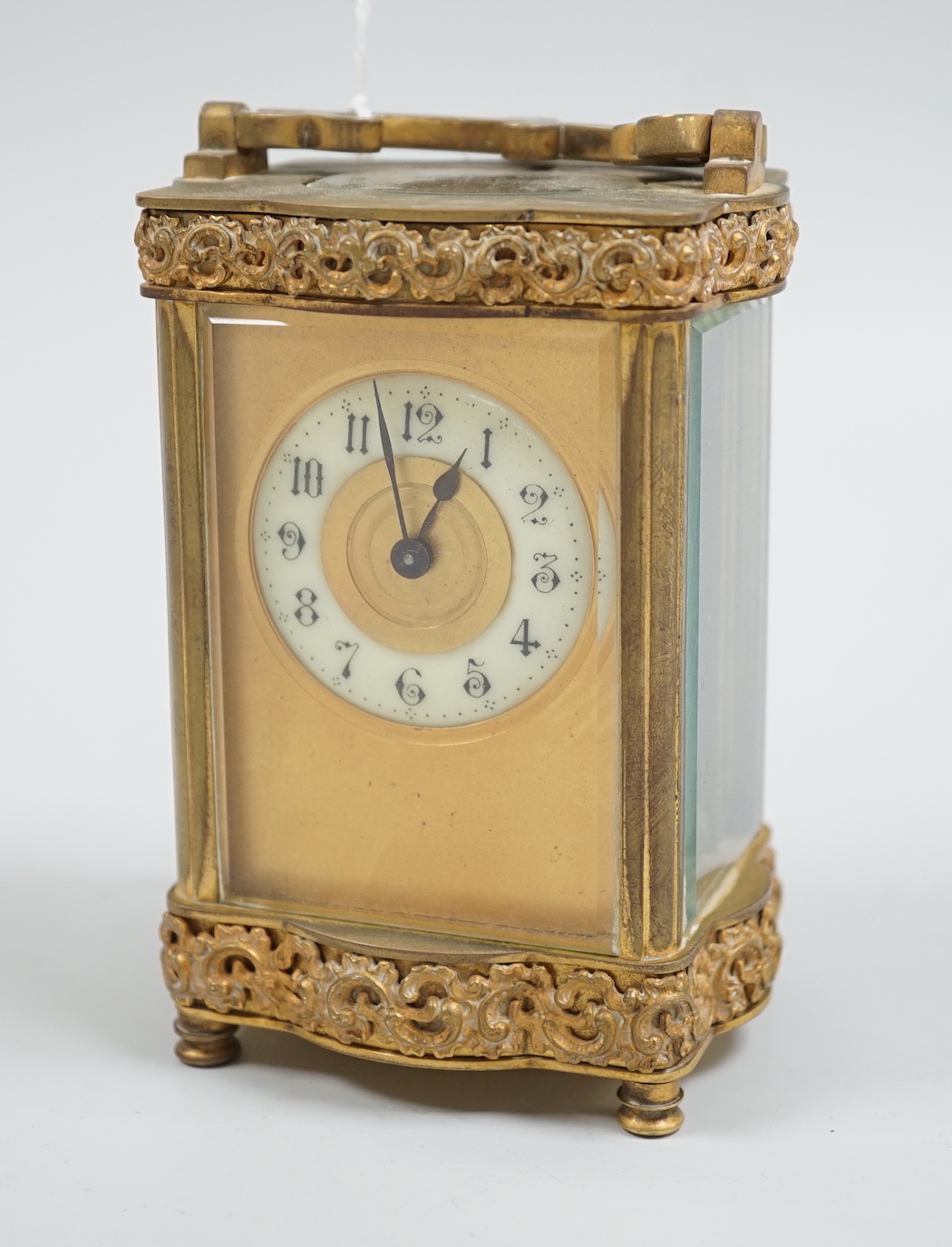 A French gilt brass serpentine carriage timepiece, 12cm high